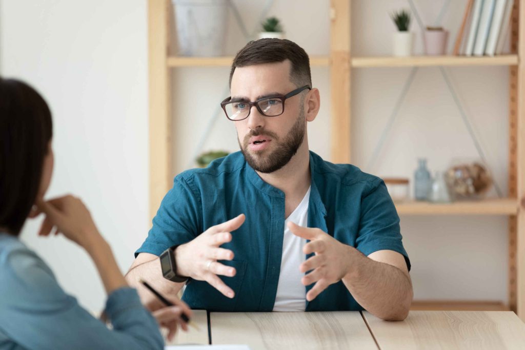 Two people in animated discussion.